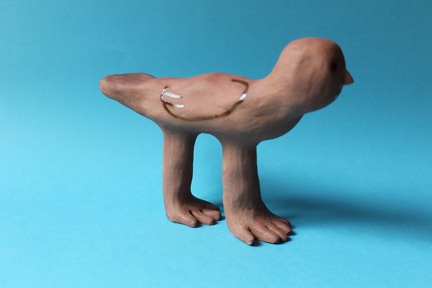Oiseau à deux mains